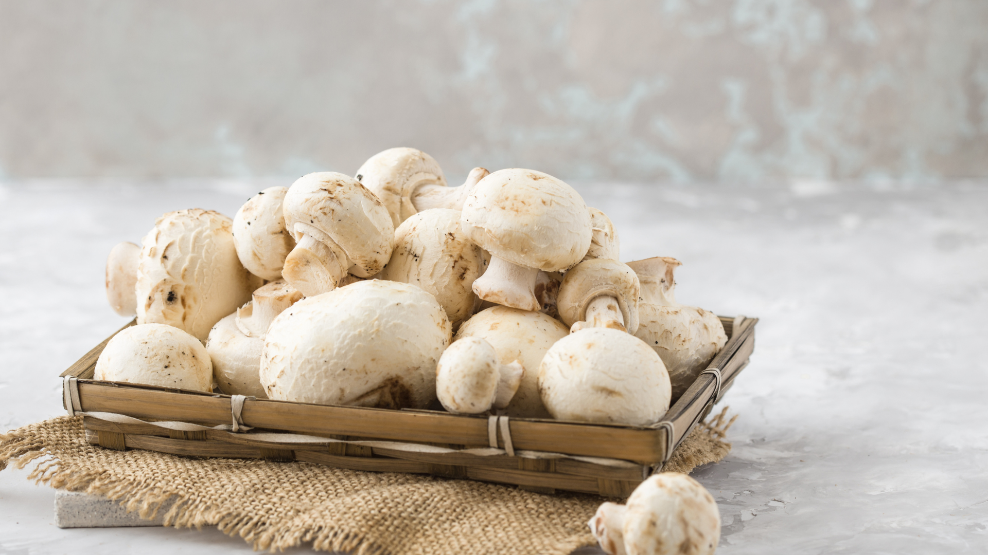 A pretty image of mushrooms displayed on a wooden platter box